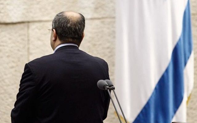 MK Ahmed Tibi standing with his back to the plenum in protest of the electoral reform bill. (photo credit: Flash90) MK Ahmed Tibi standing with his back to the plenum in protest of the electoral reform bill. (photo credit: Flash90)