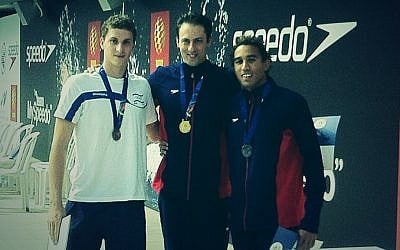 Garrett Weber-Gale (center) with his first Maccabiah gold medal (photo credit: Raphael Gellar)