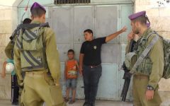 A Palestinian teenager tells IDF soldiers where the parents of 5-year-old Wadi' Maswadeh live. The boy was suspected of throwing stones at Israeli cars. (photo credit: screenshot/YouTube)