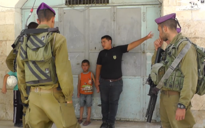 A Palestinian teenager tells IDF soldiers where the parents of 5-year-old Wadi' Maswadeh live. The boy was suspected of throwing stones at Israeli cars. (photo credit: screenshot/YouTube)