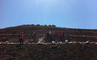 Building a peace sign at Kibbutz El-Rom. (photo credit: Reut Mishor, Dudi Meroz)