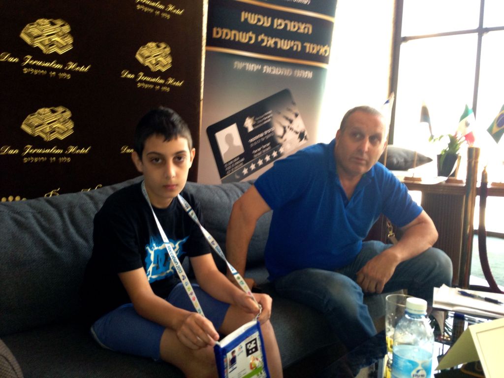 Ariel Erenberg and his father, Shmulik, waiting for the next match (photo credit: Nicole Levin/Times of Israel) Ariel Erenberg and his father, Shmulik, waiting for the next match (photo credit: Nicole Levin/Times of Israel)