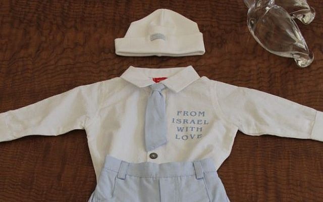 A baby outfit sent as gift from President Shimon Peres to the Duke and Duchess of Cambridge for their newborn son, 22 July 2013. (photo credit: Yosef Avi Yair Engel, Office of the President of the State of Israel) A baby outfit sent as gift from President Shimon Peres to the Duke and Duchess of Cambridge for their newborn son, 22 July 2013. (photo credit: Yosef Avi Yair Engel, Office of the President of the State of Israel)