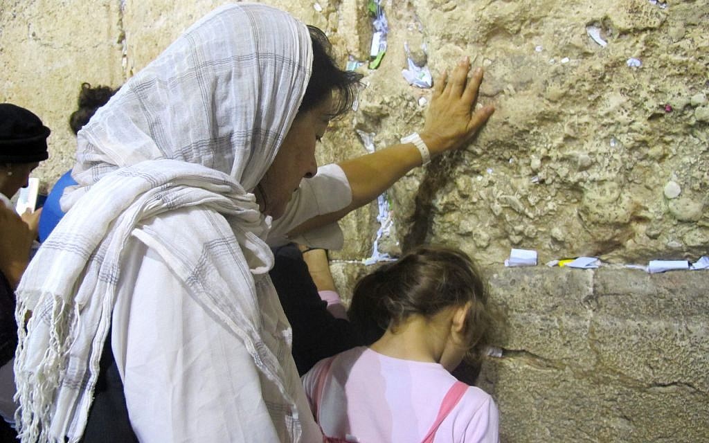 A woman and girl making their way to the Kotel on the ninth of Av (photo credit: Leeor Bronis/Times of Israel)