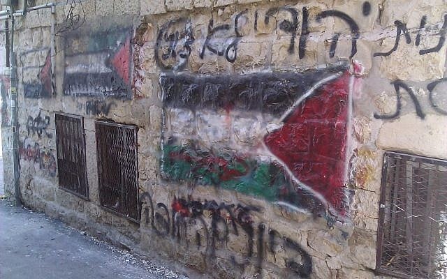 Graffiti depicting a Palestinian flag in a stronghold of the extremist Neturei Karta faction in the ultra-Orthodox neighborhood Mea Shearim (photo credit: Ilan Ben Zion/Times of Israel)