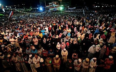Supporters of ousted Egypt's President Mohammed Morsi perform an evening prayer known as 'Tarawih' during the Islamic month of Ramadan, in Nasr City, Cairo, Egypt on July 10, 2013. (photo credit: AP Photo/Hussein Malla)