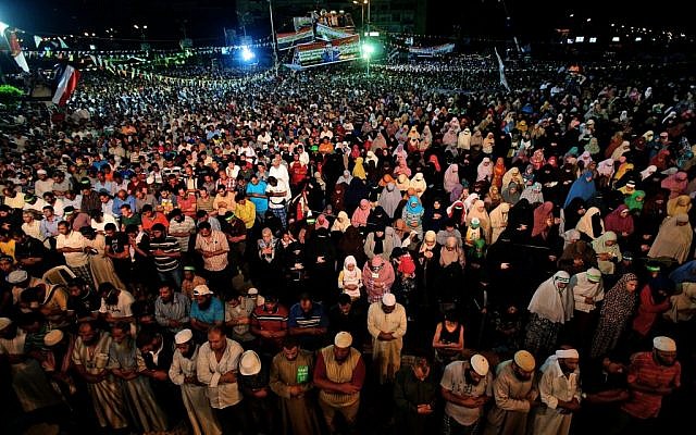 Supporters of ousted Egypt's President Mohammed Morsi perform an evening prayer known as 'Tarawih' during the Islamic month of Ramadan, in Nasr City, Cairo, Egypt on July 10, 2013. (photo credit: AP Photo/Hussein Malla) Supporters of ousted Egypt's President Mohammed Morsi perform an evening prayer known as 'Tarawih' during the Islamic month of Ramadan, in Nasr City, Cairo, Egypt on July 10, 2013. (photo credit: AP Photo/Hussein Malla)