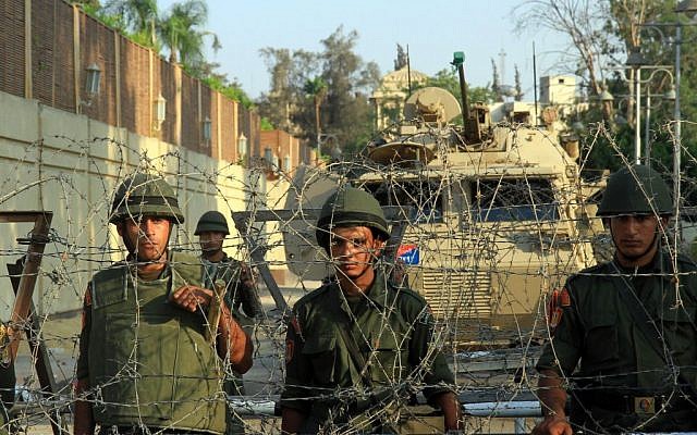 Army troops in front of the presidential palace in Cairo, Egypt, Tuesday, July 2 , 2013 (photo credit: AP/Ahmed Gomaa)