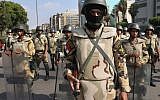 Egyptian army special forces soldiers stand guard near the Republican Guard headquarters, in Cairo, Egypt, Friday, July 19, 2013. (photo credit: AP/Hussein Malla)