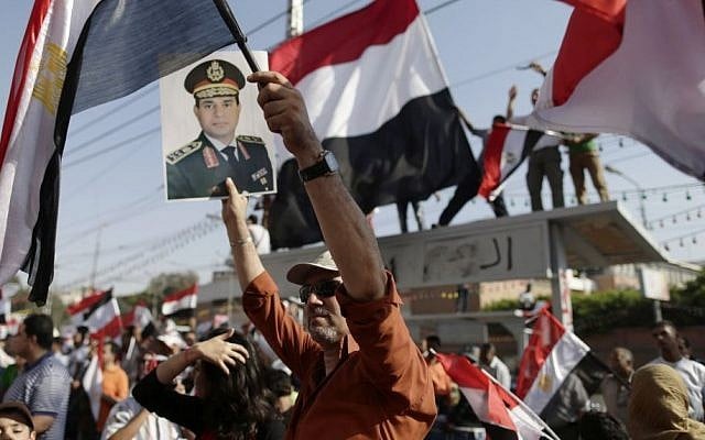 Demonstrators against Egypt's ousted President Mohammed Morsi chant slogans during a protest by the presidential palace in Cairo, Egypt, Friday, July 26, 2013. (Photo credit: AP/Hassan Ammar) Demonstrators against Egypt's ousted President Mohammed Morsi chant slogans during a protest by the presidential palace in Cairo, Egypt, Friday, July 26, 2013. (Photo credit: AP/Hassan Ammar)