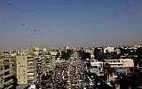 Opponents of Egypt's Islamist President Mohammed Morsi protest outside the presidential palace, at left, in Cairo, Egypt, Sunday, June 30, 2013 (photo credit: AP/Nariman El-Mofty)