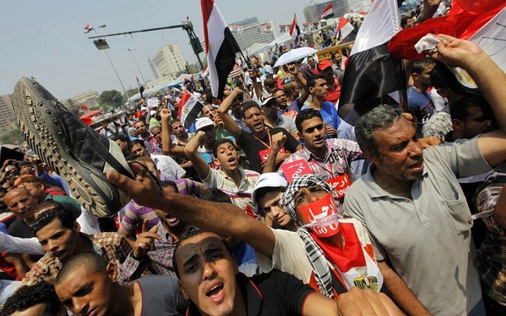 Opponents of Egypt's ousted Islamist president Mohammed Morsi shout slogans during a protest in Tahrir Square in Cairo, Egypt, July 3, 2013 (photo credit: AP/Amr Nabil) Opponents of Egypt's ousted Islamist president Mohammed Morsi shout slogans during a protest in Tahrir Square in Cairo, Egypt, July 3, 2013 (photo credit: AP/Amr Nabil)