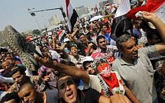 Opponents of Egypt's ousted Islamist president Mohammed Morsi shout slogans during a protest in Tahrir Square in Cairo, Egypt, July 3, 2013 (photo credit: AP/Amr Nabil)