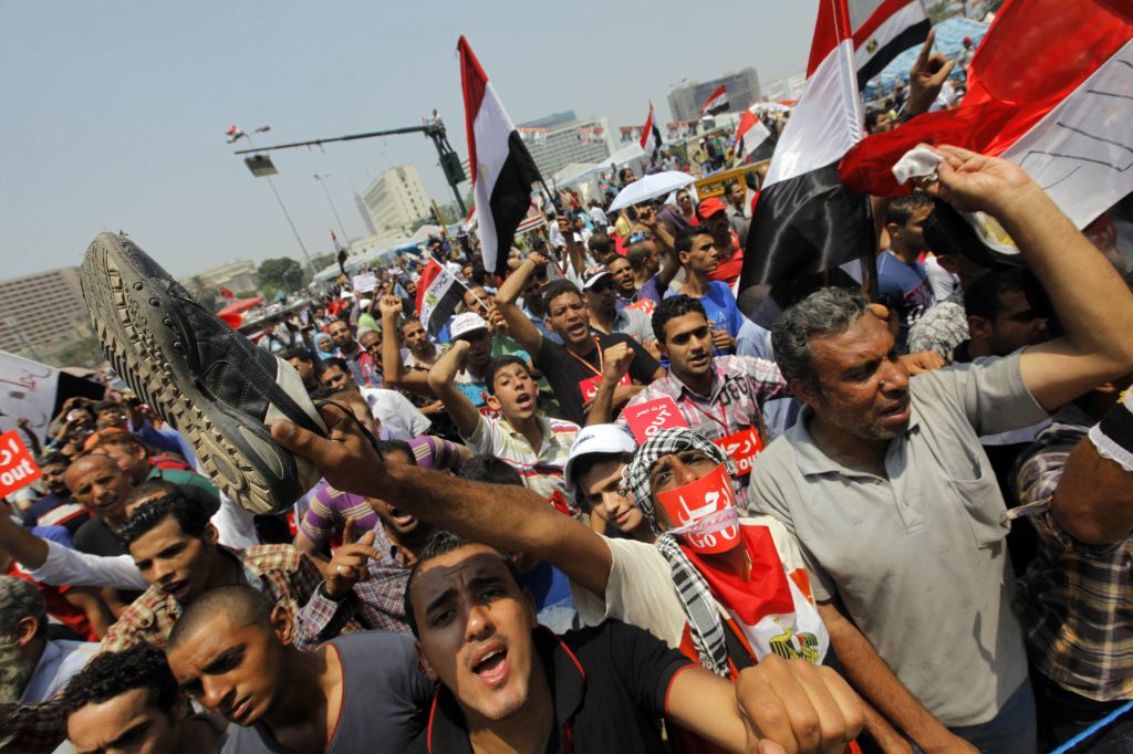 Opponents of Egypt's Islamist President Mohammed Morsi shout slogans during a protest in Tahrir Square in Cairo, Egypt on Wednesday. (photo credit: AP/Amr Nabil) Opponents of Egypt's Islamist President Mohammed Morsi shout slogans during a protest in Tahrir Square in Cairo, Egypt on Wednesday. (photo credit: AP/Amr Nabil)