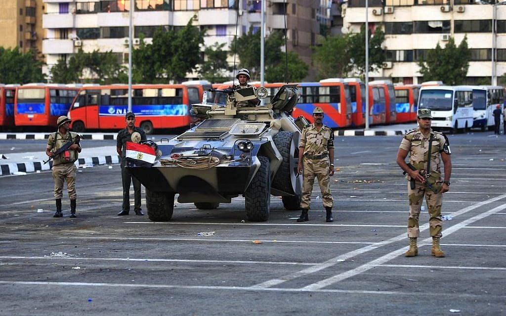 Egyptian army soldiers stand guard in Nasser City, Cairo, Egypt, Wednesday, July 3, 2013.(photo credit: AP/Hassan Ammar)