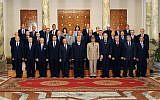 This image released by the Egyptian Presidency on Tuesday, July 16, 2013 shows interim President Adly Mansour, center, with his new cabinet ministers at the presidential palace in Cairo, Egypt (photo credit: AP)