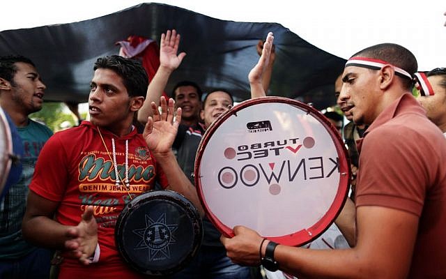 Opponents of Egypt's Islamist President Mohammed Morsi celebrate outside the presidential palace, in Cairo, Egypt,on Monday, July 1, 2013. (photo credit: AP Photo/Hassan Ammar) Opponents of Egypt's Islamist President Mohammed Morsi celebrate outside the presidential palace, in Cairo, Egypt,on Monday, July 1, 2013. (photo credit: AP Photo/Hassan Ammar)