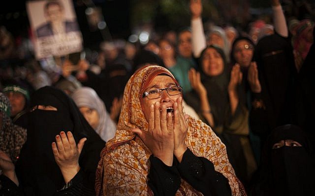 FILE: A supporter of Egypt's ousted President Mohammed Morsi cries during a protest against Egyptian Defense Minister Gen. Abdel-Fattah el-Sissi at Nasr City, where protesters have installed a camp and hold daily rallies, in Cairo, Egypt, Monday, July 29, 2013 (AP/Manu Brabo) FILE: A supporter of Egypt's ousted President Mohammed Morsi cries during a protest against Egyptian Defense Minister Gen. Abdel-Fattah el-Sissi at Nasr City, where protesters have installed a camp and hold daily rallies, in Cairo, Egypt, Monday, July 29, 2013 (AP/Manu Brabo)