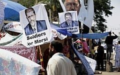 Supporter of Egypt's ousted president Mohammed Morsi in Cairo, Egypt, on Thursday, July 25, 2013. (photo credit: AP Photo/Hassan Ammar)