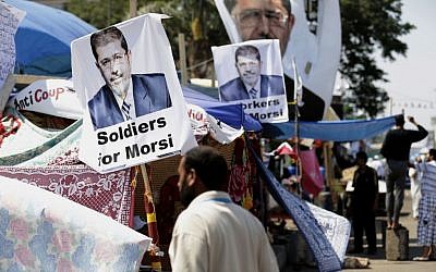 Supporter of Egypt's ousted president Mohammed Morsi in Cairo, Egypt, on Thursday, July 25, 2013. (photo credit: AP Photo/Hassan Ammar)