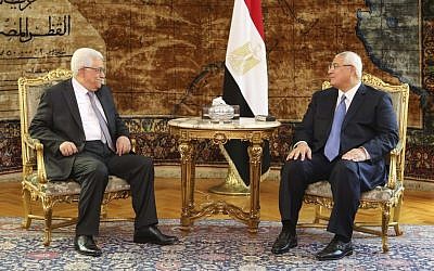 Palestinian President Mahmoud Abbas meets Egyptian interim President Adly Mansour at the Presidential Palace in Cairo, Egypt, on Monday, July 29, 2013. (photo credit: AP/Mohammed Samah, Egyptian Presidency)