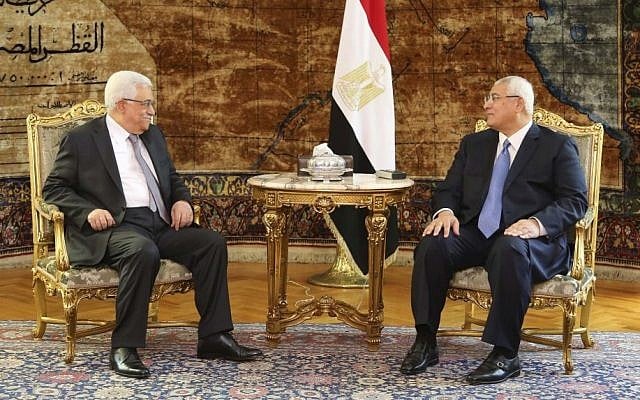 Palestinian President Mahmoud Abbas meets Egyptian interim President Adly Mansour at the Presidential Palace in Cairo, Egypt, on Monday, July 29, 2013. (photo credit: AP/Mohammed Samah, Egyptian Presidency) Palestinian President Mahmoud Abbas meets Egyptian interim President Adly Mansour at the Presidential Palace in Cairo, Egypt, on Monday, July 29, 2013. (photo credit: AP/Mohammed Samah, Egyptian Presidency)