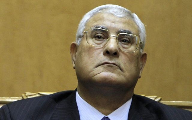 Adly Mansour listens to a speech during his swearing in as Egypt's interim president, on July 4, 2013 (photo credit: AP/Amr Nabil/File)