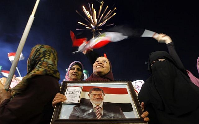 Supporters of Egypt's Islamist President Mohammed Morsi attend a rally in Nasser City, in Cairo, Egypt, Egypt, Monday, July 1, 2013 (photo credit: AP/Amr Nabil) Supporters of Egypt's Islamist President Mohammed Morsi attend a rally in Nasser City, in Cairo, Egypt, Egypt, Monday, July 1, 2013 (photo credit: AP/Amr Nabil)