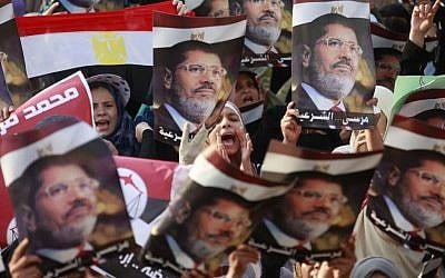 Supporters of the ousted President Mohammed Morsi demonstrate in Nasr City, a suburb of Cairo, Egypt, on Monday, July 8, 2013. (photo credit/Nasser Shiyoukhi/AP)