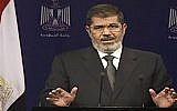 Egyptian President Mohammed Morsi addresses the nation in a televised speech on Tuesday, July 2. (photo credit: AP Photo/Egyptian State Television)
