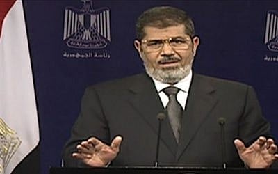 Egyptian President Mohammed Morsi addresses the nation in a televised speech on Tuesday. (photo credit: AP Photo/Egyptian State Television)