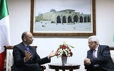 Palestinian Authority President Mahmoud Abbas, right, meets with Italian Prime Minister Enrico Letta upon his arrival in the West Bank city of Ramallah Tuesday, July 2, 2013. (photo credit: AP/Fadi Arouri)