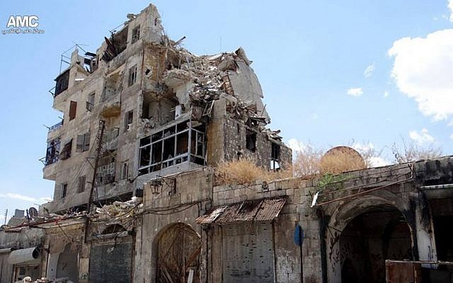 In this Sunday, June 30, 2013 citizen journalism image provided by Aleppo Media Center AMC, which has been authenticated based on its contents and other AP reporting, homes are seen destroyed by Syrian government airstrikes and shelling in Aleppo, Syria (AP Photo/Aleppo Media Center AMC)