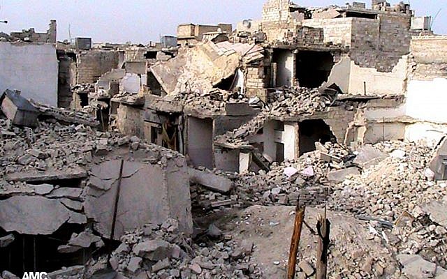 Homes destroyed by Syrian government airstrikes and shelling in Aleppo, Syria, Tuesday, July 2, 2013 (photo credit: AP/Aleppo Media Center AMC) Homes destroyed by Syrian government airstrikes and shelling in Aleppo, Syria, Tuesday, July 2, 2013 (photo credit: AP/Aleppo Media Center AMC)