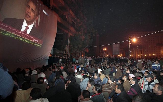 In this Wednesday, Feb. 2, 2011 file photo, anti-government protesters gathered in Cairo's Tahrir Square, watch a screen showing US President Barack Obama live on a TV broadcast from Washington, speaking about the situation in Egypt (photo credit: AP/Lefteris Pitarakis) In this Wednesday, Feb. 2, 2011 file photo, anti-government protesters gathered in Cairo's Tahrir Square, watch a screen showing US President Barack Obama live on a TV broadcast from Washington, speaking about the situation in Egypt (photo credit: AP/Lefteris Pitarakis)