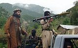 Pakistani Taliban patrol in the tribal region of South Waziristan, 2012. (photo credit: AP/Ishtiaq Mahsud/File)