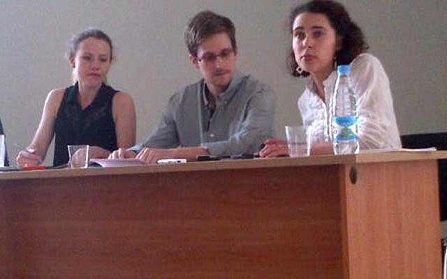 NSA leaker Edward Snowden, center, attends a news conference at Moscow's Sheremetyevo Airport with Sarah Harrison of WikiLeaks, left, Friday, July 12 (photo credit: AP/Human Rights Watch, Tanya Lokshina) NSA leaker Edward Snowden, center, attends a news conference at Moscow's Sheremetyevo Airport with Sarah Harrison of WikiLeaks, left, Friday, July 12 (photo credit: AP/Human Rights Watch, Tanya Lokshina)