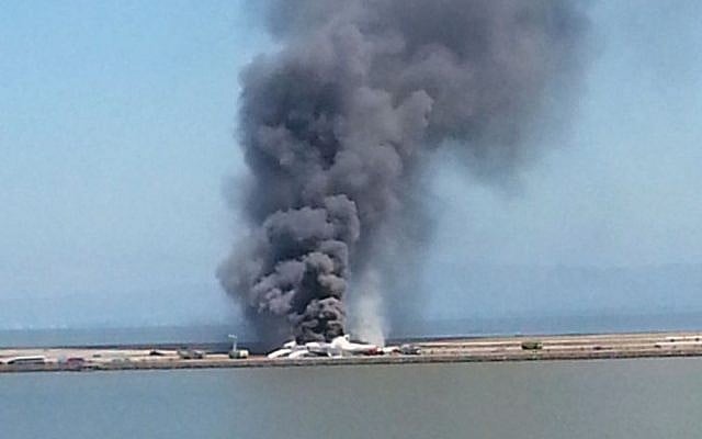 This photo provided by Antonette Edwards shows what a federal aviation official says was an Asiana Airlines flight crashing while landing at San Francisco airport on Saturday, July 6, 2013. It was not immediately known whether there were any injuries. (AP Photo/Antonette Edwards)