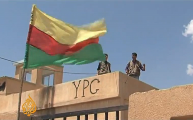 Illustrative photo of fighters from the Kurdish YPG militia alongside the group's flag in northern Syria (al-Jazeera video screenshot , YouTube) Illustrative photo of fighters from the Kurdish YPG militia alongside the group's flag in northern Syria (al-Jazeera video screenshot , YouTube)