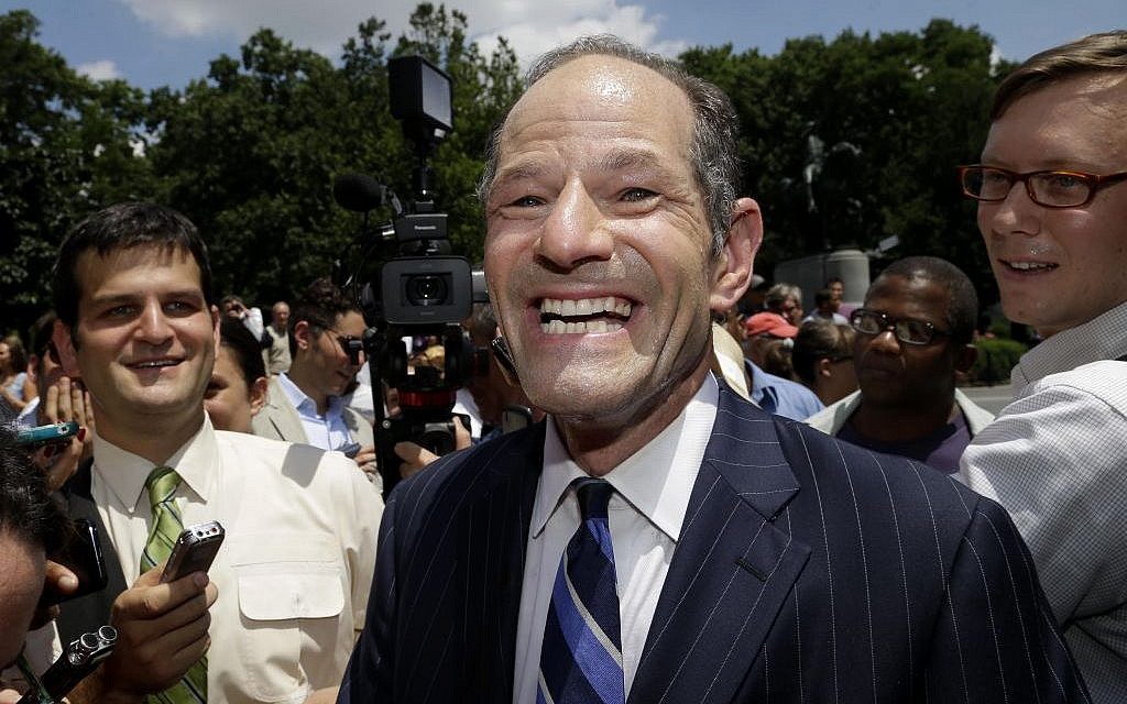 Eliot Spitzer is surrounded by media as he tries to collect signatures for his run for New York City Comptroller in New York, Monday, July 8, 2013. (photo credit: AP Photo/Seth Wenig) Eliot Spitzer is surrounded by media as he tries to collect signatures for his run for New York City Comptroller in New York, Monday, July 8, 2013. (photo credit: AP Photo/Seth Wenig)