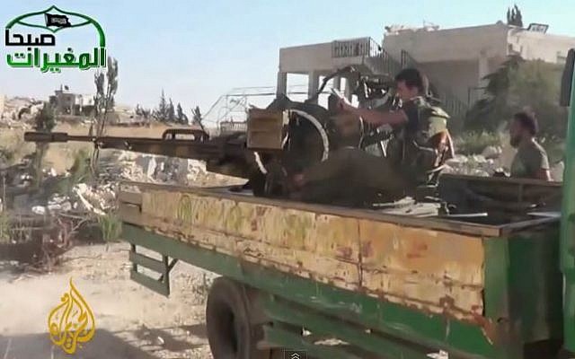 Syrian rebels in Khan al-Assal. (screen capture: Youtube/AlJazeeraenglish) Syrian rebels in Khan al-Assal. (screen capture: Youtube/AlJazeeraenglish)
