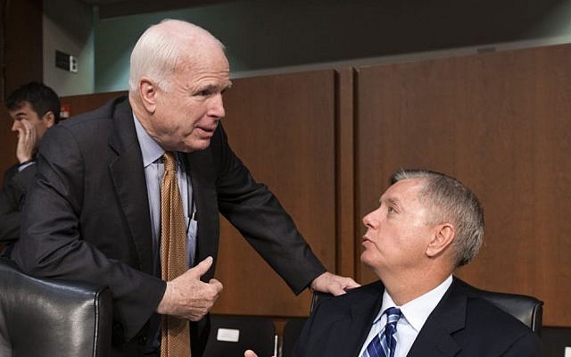 US Senator John McCain, left, talks with Senator Lindsey Graham on Capitol Hill in Washington in July .(photo credit: AP/J. Scott Applewhite) US Senator John McCain, left, talks with Senator Lindsey Graham on Capitol Hill in Washington in July .(photo credit: AP/J. Scott Applewhite)