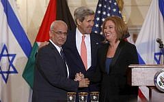Saeb Erekat (left), with John Kerry (center), and Tzipi Livni at a July 2013 press conference in Washington, DC, relaunching peace talks. (photo credit: AP/Charles Dharapak)