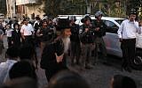 Israeli Border Police officers keep the peace in Jerusalem's Mea Shearim neighborhood on Tuesday, July 9. (photo credit: Flash90)