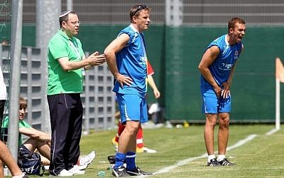 Scott Shulton (right) encourages his players at the European Maccabi games, 2011 (photo credit: courtesy)