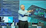 Intel's Yair Hochberg demonstrates one of Intel's smartphones July 6 2013 (Photo credit: Courtesy)