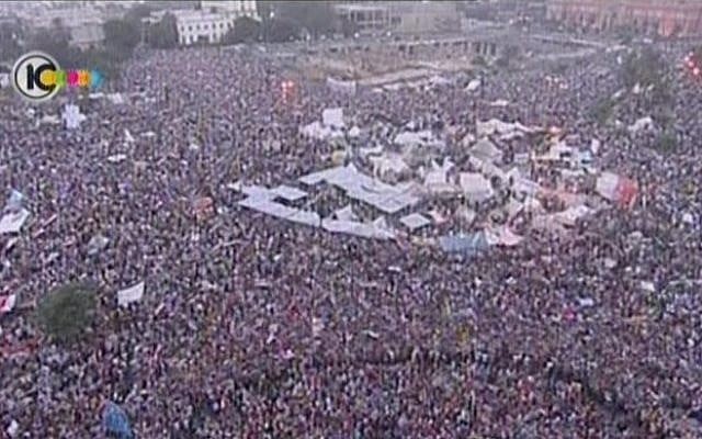 Hundreds of thousands of anti-Morsi protesters demonstrate at Cairo's Tahrir Square, one month before the military ousted him (photo credit: screen capture/Channel 10 news) Hundreds of thousands of anti-Morsi protesters demonstrate at Cairo's Tahrir Square, one month before the military ousted him (photo credit: screen capture/Channel 10 news)