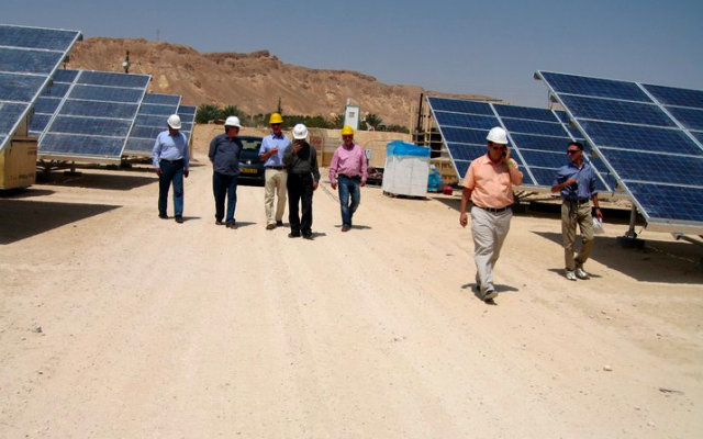 Yosef Abramowitz (in peach shirt) and his partners at Israel's first solar field in 2013 (photo credit: Courtesy Yosef Abramowitz) Yosef Abramowitz (in peach shirt) and his partners at Israel's first solar field in 2013 (photo credit: Courtesy Yosef Abramowitz)