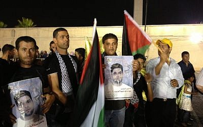 The family of Youssef Irsheid awaits his arrival at the presidential compound in Ramallah, August 13, 2013 (photo credit: Elhanan Miller/Times of Israel)