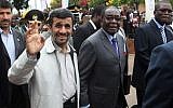 Former Iranian president Mahmoud Ahmadinejad, left, and Zimbabwean President Robert Mugabe, greet the crowd in Bulawayo, Friday, April 23, 2010 during the opening of a trade fair. Ahmadinejad said during the trip that Iran could find like-minded leaders in Africa who were also facing problems with the West. (Photo credit: AP/Tsvangirayi Mukwazhi)